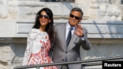 We're not suggesting that U.S. actor George Clooney and his wife Amal Alamuddin do not have stress. But a new study finds their stress might be better. Here the couple leave a seven-star hotel in Venice, Italy, 2014.( REUTERS/Stefano Rellandini)