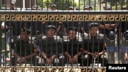 Members of the riot police in front of the parliament building in Cairo, July 10, 2012. 