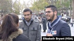 Nizarr Bourchada (R), a member of France's Union of French Muslim Democrats, on Monday visited Place de la Republique to pay tribute to the 129 people killed in last week’s Paris attacks, Paris, Nov. 16, 2015. (Photo - L. Bryant/VOA)