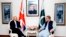 In this photo released by the Press Information Department, Pakistani Foreign Minister Shah Mahmood Qureshi, right, meets visiting British Home Secretary Sajid Javid at the Foreign Ministry in Islamabad, Pakistan, Monday, Sept. 17, 2018. Javid said Monday that the eradication of corruption is a priority for both countries and announced a new partnership between them that would strive for "justice and accountability."