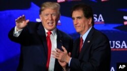 President Donald Trump with Rep. Jim Renacci, R-Ohio, right, waves during a roundtable discussion on tax cuts at Cleveland Public Auditorium and Conference Center in Cleveland, Ohio, May 5, 2018.