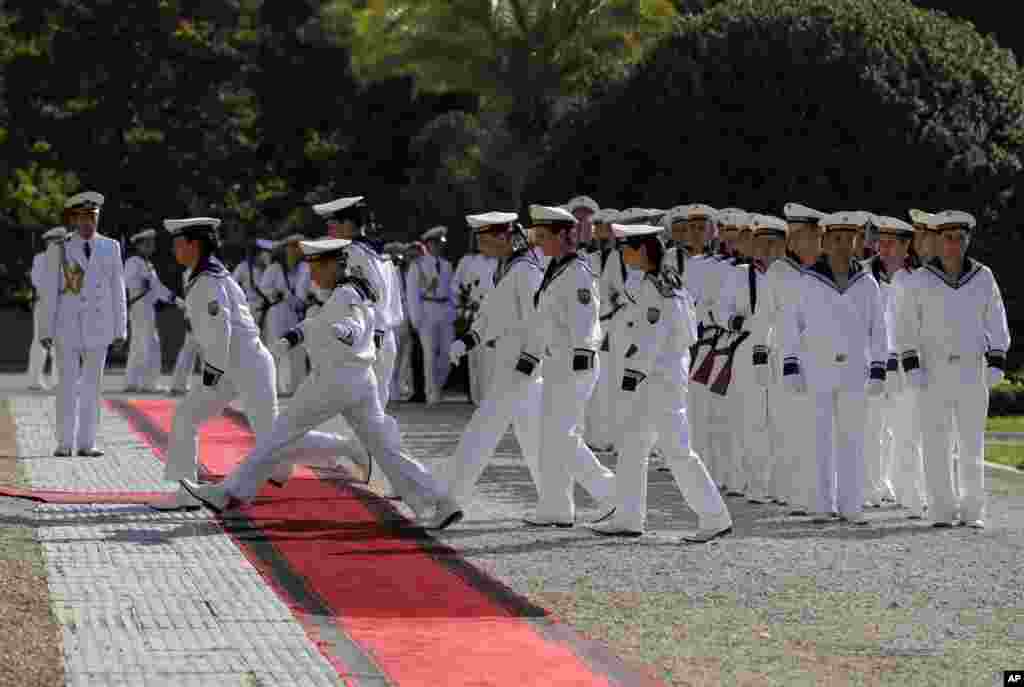 Bulgarian sailors prepare for the welcoming ceremony for French President Emmanuel Macron at the Euxinograd residence outside Varna, Bulgaria.