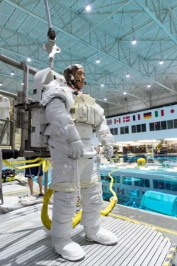 In this November 7, 2018, photo, 2017 astronaut candidate Jonny Kim prepares for underwater spacewalk training at NASA Johnson Space Center’s Neutral Buoyancy Laboratory in Houston. Photo Credit: (NASA/Robert Markowitz)