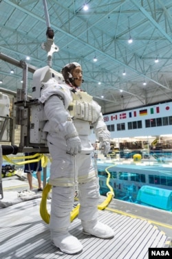 In this November 7, 2018, photo, 2017 astronaut candidate Jonny Kim prepares for underwater spacewalk training at NASA Johnson Space Center’s Neutral Buoyancy Laboratory in Houston. Photo Credit: (NASA/Robert Markowitz)