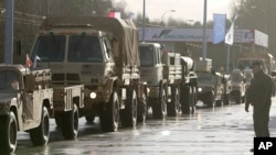 12일 미 육군 병력수송 차량이 폴란드 올쉬나 국경을 통과해 자간의 주둔지로 향하고 있다. 