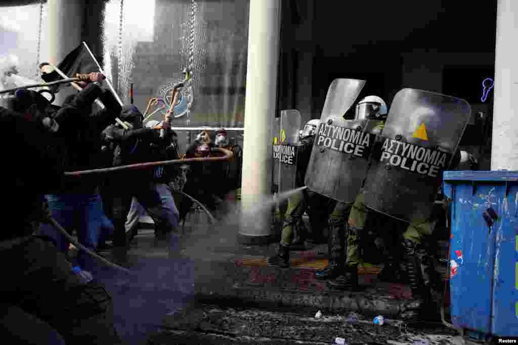 Farmers from the island of Crete clash with riot police during a demonstration outside the Agriculture Ministry in Athens, Greece.