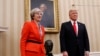 President Donald Trump stands with British Prime Minister Theresa May in the Oval Office of the White House in Washington, Jan. 27, 2017.