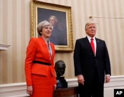 President Donald Trump stands with British Prime Minister Theresa May in the Oval Office of the White House in Washington, Jan. 27, 2017. Concerns mount in Europe over Trump's future course and rising populism on the continent.