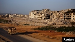 (FILE) A general view of damaged buildings in Ein Terma, a district of eastern Ghouta, Syria, Feb. 26, 2019. 