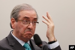 FILE - President of Brazil’s Chamber of Deputies Eduardo Cunha, speaks during his testimony at the Parliamentary Commission of Enquiry of the Chamber of Deputies on the Petrobras corruption scandal in Brasilia, March 12, 2015