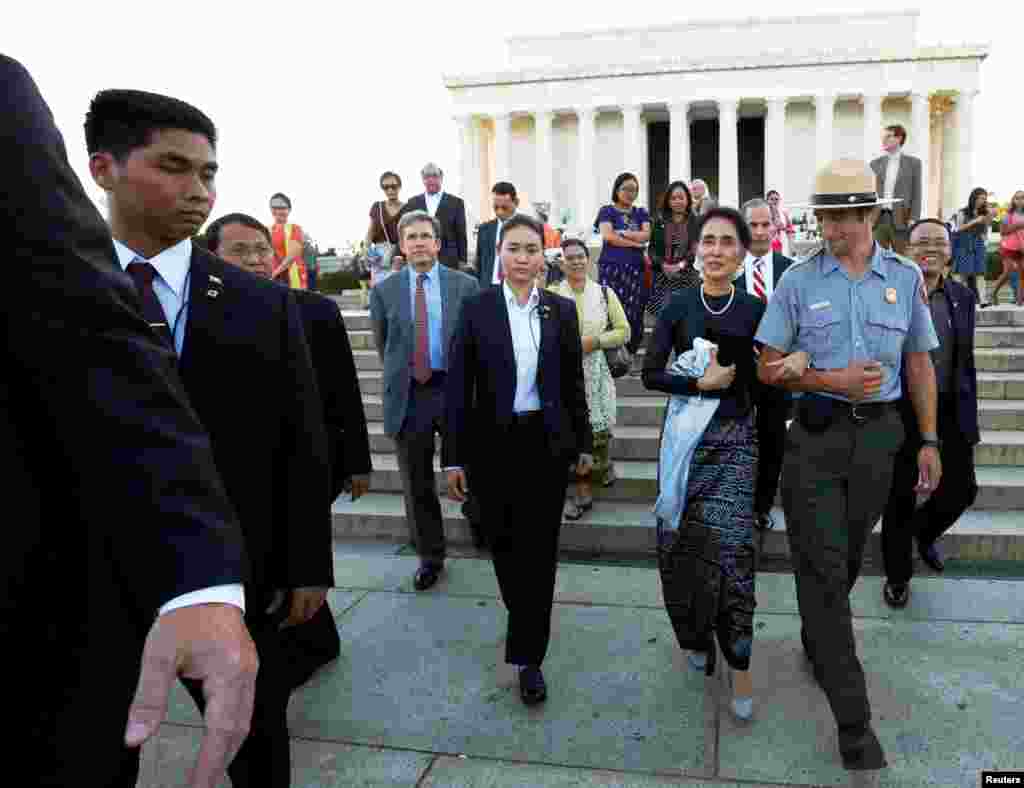 Aung San Suu Kyi is guided by U.S. National Park Service Ranger Heath Mitchell (R) as she visits the Lincoln Memorial in Washington, D.C., Sept. 14, 2016.