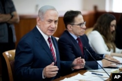 FILE - Israeli Prime Minister Benjamin Netanyahu attends the weekly cabinet meeting at his office in Jerusalem.