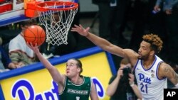 FILE - In this Dec. 20, 2019, file photo, Binghamton's Hakon Hjalmarsson (1), of Iceland, shoots as Pittsburgh's Terrell Brown (21) defends during the second half of an NCAA college basketball game in Pittsburgh. Hjalmarsson is just starting his American basketball experience.