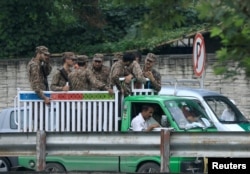 Soldiers arrive to guard the judicial complex where election material will be distributed ahead of a general election in Rawalpindi, Pakistan, July 24, 2018.
