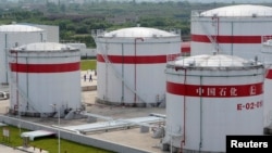 FILE - Oil tanks at a Sinopec plant in Hefei, Anhui province, May 31, 2009. China has announced that it will limit supplies of refined petroleum products to North Korea.