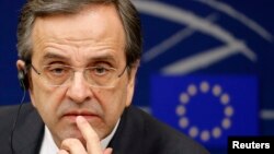 Greek Prime Minister Antonis Samaras attends a news conference after a debate on the program of Greece's presidency of the EU for the next six months at the European Parliament in Strasbourg, France, Jan. 15, 2014. 