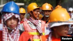 Workers gather as they rally to mark May Day in Phnom Penh, Cambodia, May 1, 2018. 