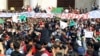 Hundreds of people gather to protest the decision of Algerian President Abdelaziz Bouteflika to run for a fifth term, in Algiers, Algeria, March 5, 2019. War veterans have now joined the protesters.