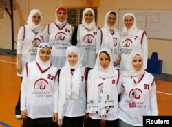 FILE - Saudi Arabia's Jeddah United pose before their friendly basketball game against Jordan's Al Reyadeh in Amman, April 21, 2009.