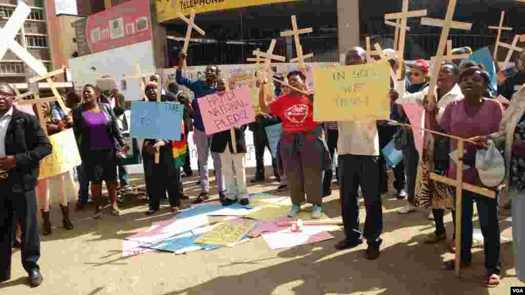 Zimbabweans stage protest over the introduction of the national pledge.