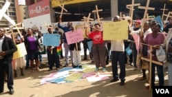 FILE: Zimbabweans stage protest over the introduction of the national pledge.