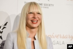 FILE - Sia arrives at The Humane Society Of The United States 60th Anniversary Benefit Gala in Beverly Hills, Calif.