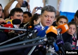 FILE - Ukrainian President Petro Poroshenko talks to reporters.