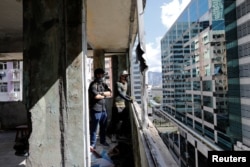 HK URBEX members inspect an abandoned residential building in Hong Kong, China, June 7, 2017.