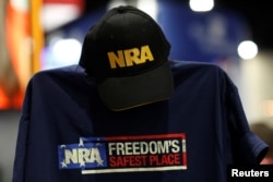 A cap and shirt are displayed at the booth for the National Rifle Association (NRA) at the Conservative Political Action Conference (CPAC) at National Harbor, Maryland, U.S., Feb. 23, 2018.