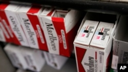 FILE - Cartons of Philip Morris' Marlboro cigarettes are on display at a market in Palo Alto, California, Feb. 2, 2009.