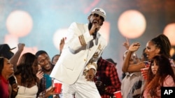 FILE - R. Kelly performs during the 2015 Soul Train Awards at the Orleans Arena on Nov. 6, 2015, in Las Vegas.