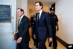 FILE - White House adviser Jared Kushner, center, and his attorney Abbe Lowell, left, arrive on Capitol Hill in Washington to be interviewed behind closed doors by the House Intelligence Committee, July 25, 2017.