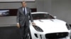 FILE - Ratan Tata poses with Jaguar's newly launched C-X16 car during India's Auto Expo, in New Delhi, Jan. 5, 2012.