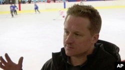 FILE - In this image made from video taken on March 11, 2016, entrepreneur Michael Spavor speaks during a friendly hockey match between visiting foreigners and North Korean players in Pyongyang, North Korea.