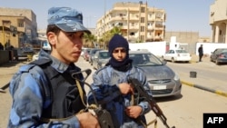 FILE - Forces loyal to Libyan strongman Khalifa Haftar patrol in the southern Libyan city of Sabha, Feb. 9, 2019. An attack by militants May 4, 2019, on guards near a Sabha air base left nine soldiers dead. 