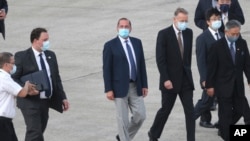 U.S. Health and Human Services Secretary Alex Azar, center, arrives at Taipei Songshan Airport in Taipei, Taiwan, Aug. 9, 2020.