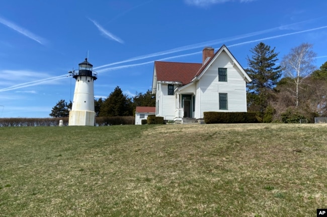 Warwick Neck Light, that dates to 1827 and was a onetime important navigation tool for mariners making their way to Providence, R.I., stands near Narragansett Bay, April 12, 2023, in Warwick, R.I. (Barbara Salfity/General Services Administration via AP)