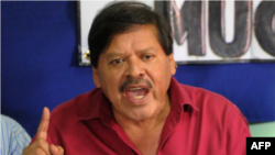 FILE - Via Campesina farmers group coordinator Rafael Alegria speaks at a press conference in Tegucigalpa, Sept. 27, 2012. Alegria says activists have been reporting harassment from mining, timber and hydroelectric companies and landowners for years.