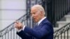 President Joe Biden speaks with an attendee during an Independence Day celebration on the South Lawn of the White House, Sunday, July 4, 2021, in Washington. (AP Photo/Patrick Semansky)