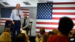 Democratic presidential candidate and former Vice President Joe Biden answers a question from Crystal Gadsden White about the importance he places on unions during a town hall on Sunday, July 7, 2019, in Charleston, S.C.