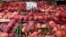 Peaches are displayed on a fruit vendor's stall at a grocery market in Athens, Greece, Aug. 8, 2014. 