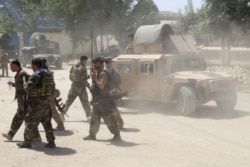 Afghan Commando forces are seen at the site of a battle field where they clash with the Taliban insurgent in Kunduz province, June 22, 2021.