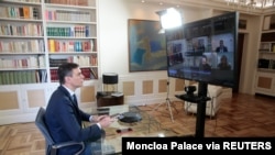 Spanish Prime Minister Pedro Sanchez holds a videoconference with some of his ministers over the coronavirus outbreak, at the Moncloa Palace in Madrid, March 13, 2020. 