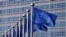 EU flags flutter outside the EU Commission headquarters in Brussels
