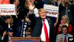 Republican presidential candidate Donald Trump waves during a rally in Biloxi, Mississipi, Jan. 2, 2016. Trump dismissed his appearance on a recruitment video made by the Somali militant group al-Shabab. 