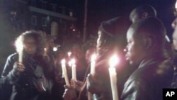 Haitians gather for candlelight vigil in front of Haitian Embassy in Washington DC, 13 Jan 2010