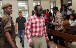 Tanzanian investigative journalist Erick Kabendera arrives at the Kisutu Residents Magistrate Court in Dar es Salaam, Tanzania, Aug. 19, 2019.