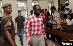 Tanzanian investigative journalist Erick Kabendera arrives at the Kisutu Residents Magistrate Court in Dar es Salaam, Tanzania, Aug. 19, 2019.