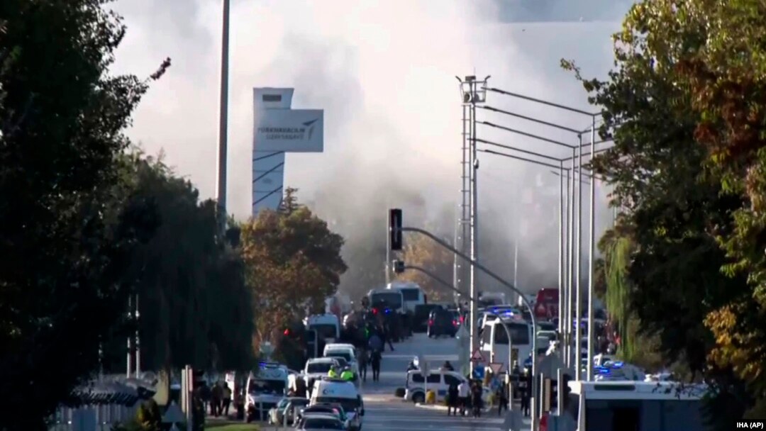 Smoke rises as emergency rescue teams and police officers attend outside Turkish Aerospace Industries Inc. on the outskirts of Ankara, Oct. 23, 2024. 