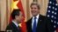 Secretary of State John Kerry talks with with Chinese Foreign Minister Wang Yi as they wrap up their news conference at the State Department in Washington, Feb. 23, 2016.